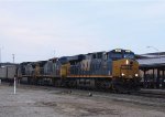 CSX 861 leads a coal train past the station on a dreary morning